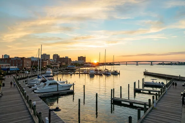 A vivid natural colored sunset over the beautiful waterfront in Hampton, Virginia, a thriving peninsula community.