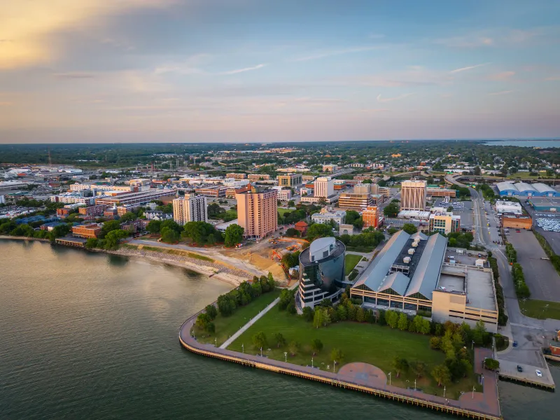 An aerial view of downtown Newport News, Virginia at dusk, the riverfront city CareWorks ABA serves end to end.